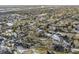 Aerial view of a residential neighborhood with houses and trees covered in snow at 5341 Fenmore Rd, Indianapolis, IN 46228