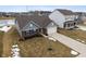 Two-story house with a brick facade and attached garage, winter scene at 5486 W Woodhaven Dr, McCordsville, IN 46055