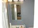 Small bathroom with vanity and decorative mirror at 5914 Mornay Dr, Indianapolis, IN 46254