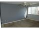 Spacious bedroom with gray walls and ceiling fan at 5914 Mornay Dr, Indianapolis, IN 46254