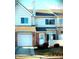Charming townhome featuring a brick facade, attached garage, and well-maintained landscaping at 5914 Mornay Dr, Indianapolis, IN 46254