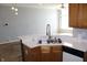 Kitchen with double bowl sink overlooking the living area at 5914 Mornay Dr, Indianapolis, IN 46254