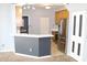 Kitchen with breakfast bar features stainless steel appliances and ample counter space at 5914 Mornay Dr, Indianapolis, IN 46254