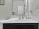 Modern bathroom vanity with marble countertop and a large mirror at 6125 N Cedarwood Dr, McCordsville, IN 46055