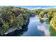 Breathtaking aerial view showcasing the home's prime waterfront location with lush surroundings and tranquil lake waters at 6234 Bobwhite Dr, Nineveh, IN 46164