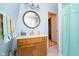 Bathroom vanity with mirror and marble countertops; includes colorful striped towels and shower at 6234 Bobwhite Dr, Nineveh, IN 46164