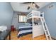 Bright bedroom featuring a bunk bed with a ladder, hardwood floors, and natural light at 6234 Bobwhite Dr, Nineveh, IN 46164