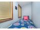 Small bedroom with one twin bed, sunny windows, and blue walls at 6234 Bobwhite Dr, Nineveh, IN 46164