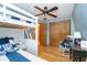 Charming bedroom with bunk beds, wood floors, a ceiling fan, and closet space at 6234 Bobwhite Dr, Nineveh, IN 46164
