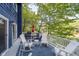 Expansive deck with ample seating, perfect for outdoor dining and enjoying panoramic lake views at this lakeside retreat at 6234 Bobwhite Dr, Nineveh, IN 46164