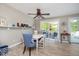 Dining area featuring lake decor, a ceiling fan, and sliding glass door to the deck at 6234 Bobwhite Dr, Nineveh, IN 46164