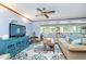 Open-concept living area boasts natural light, plush seating, and a stylish rug for a comfortable gathering space at 6234 Bobwhite Dr, Nineveh, IN 46164