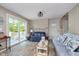 Bright living room with a view to the deck, lake decor, and comfortable seating at 6234 Bobwhite Dr, Nineveh, IN 46164