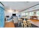 Open concept living area with hardwood floors, comfortable seating, and a dining table at 6234 Bobwhite Dr, Nineveh, IN 46164
