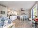 Open concept living area with wood floors, lake-themed decor, and plenty of natural light at 6234 Bobwhite Dr, Nineveh, IN 46164