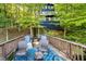 Private outdoor patio with ample seating surrounded by lush greenery, ideal for enjoying nature at 6234 Bobwhite Dr, Nineveh, IN 46164