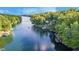 Scenic aerial view of waterfront homes nestled along a tranquil lake surrounded by lush greenery at 6234 Bobwhite Dr, Nineveh, IN 46164