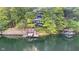 Waterfront property with a boat dock and lift, offering direct access to the serene lake at 6234 Bobwhite Dr, Nineveh, IN 46164