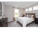 Cozy bedroom with a queen-size bed and large window at 625 Waterford Ln, Westfield, IN 46074