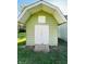 Light green storage shed with white doors in a grassy area at 644 Fankboner Ct, Greenwood, IN 46143