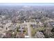 Picturesque aerial view of a residential neighborhood showcasing tree-lined streets and a variety of homes at 6551 Forrest Commons Blvd, Indianapolis, IN 46277