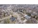 Captivating aerial view of a suburban community featuring diverse home styles, swimming pools, and landscaped yards at 6551 Forrest Commons Blvd, Indianapolis, IN 46277