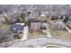 Lovely aerial shot showcases a mix of stately homes in established neighborhood with mature landscaping and winding roads at 6551 Forrest Commons Blvd, Indianapolis, IN 46277