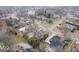 Aerial view of a peaceful neighborhood with manicured lawns, established trees, and an assortment of beautiful homes at 6551 Forrest Commons Blvd, Indianapolis, IN 46277