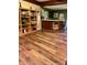 Finished basement with a custom bar and built-in bookshelf. Ready for entertainment or Gathering gatherings at 6551 Forrest Commons Blvd, Indianapolis, IN 46277