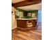 Basement bar area is perfect for entertaining friends with its unique wooden design at 6551 Forrest Commons Blvd, Indianapolis, IN 46277