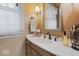 Tasteful powder room with a white countertop, and modern fixtures at 6551 Forrest Commons Blvd, Indianapolis, IN 46277