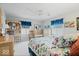 Bright bedroom featuring two twin beds, a crib, and a wooden bookshelf with a built-in desk at 6551 Forrest Commons Blvd, Indianapolis, IN 46277