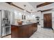 Contemporary kitchen with an island, stainless steel appliances, and ample cabinet space at 6551 Forrest Commons Blvd, Indianapolis, IN 46277
