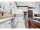 Modern kitchen featuring white cabinets, granite countertops, and stainless steel appliances at 6551 Forrest Commons Blvd, Indianapolis, IN 46277