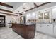 Spacious kitchen features a large island, stainless steel appliances, and white cabinetry at 6551 Forrest Commons Blvd, Indianapolis, IN 46277