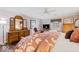 Comfortable main bedroom features hardwood floors, a ceiling fan, and natural light at 6551 Forrest Commons Blvd, Indianapolis, IN 46277