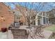 Secluded patio with brick paving, outdoor seating, and view of sunroom at 6551 Forrest Commons Blvd, Indianapolis, IN 46277