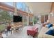 Bright sunroom with brick flooring, a TV, and seating at 6551 Forrest Commons Blvd, Indianapolis, IN 46277