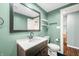 Modern bathroom with a dark vanity and white subway tile at 671 Knollwood Dr, Columbus, IN 47203