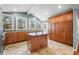 Open kitchen boasts granite countertops and ample wood cabinetry at 671 Knollwood Dr, Columbus, IN 47203