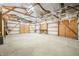 Large unfinished workshop with exposed beams at 671 Knollwood Dr, Columbus, IN 47203