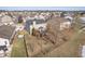 Aerial view of house showcasing a large backyard with a deck and patio at 7541 Mather Ln, Indianapolis, IN 46239