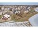 Aerial view of house showcasing a large backyard and a neighborhood pond at 7541 Mather Ln, Indianapolis, IN 46239