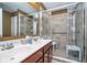 Bathroom with double sinks, large shower, and grab bars at 7541 Mather Ln, Indianapolis, IN 46239