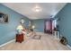 Spacious bonus room with neutral walls and plush seating at 7541 Mather Ln, Indianapolis, IN 46239