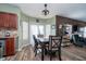 Kitchen dining area with hardwood floors and access to backyard at 7541 Mather Ln, Indianapolis, IN 46239