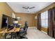 Home office with large desk, two monitors, and comfortable chair at 7541 Mather Ln, Indianapolis, IN 46239