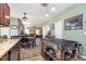 Eat-in kitchen with island and view into the living room at 7541 Mather Ln, Indianapolis, IN 46239