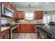 Updated kitchen featuring granite countertops and stainless steel appliances at 7541 Mather Ln, Indianapolis, IN 46239