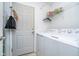 Convenient laundry room with washer, dryer, and exterior access at 7541 Mather Ln, Indianapolis, IN 46239